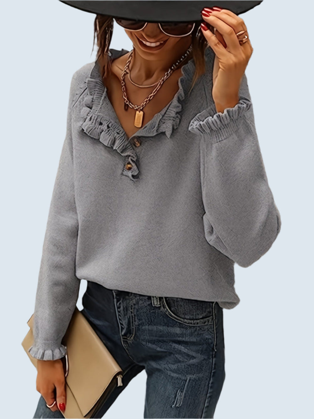 V-ringad tröja med volang i nederkanten