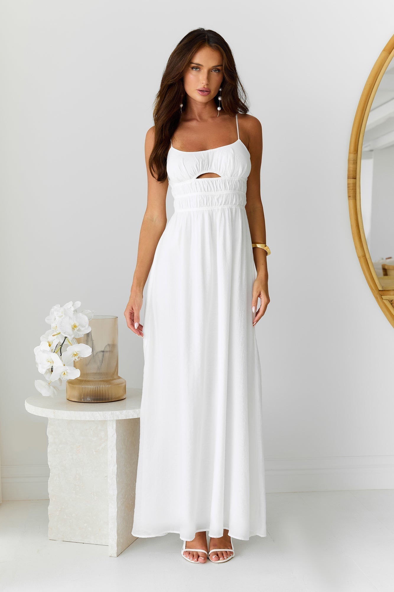 White long dress with narrow straps and hollow-out details