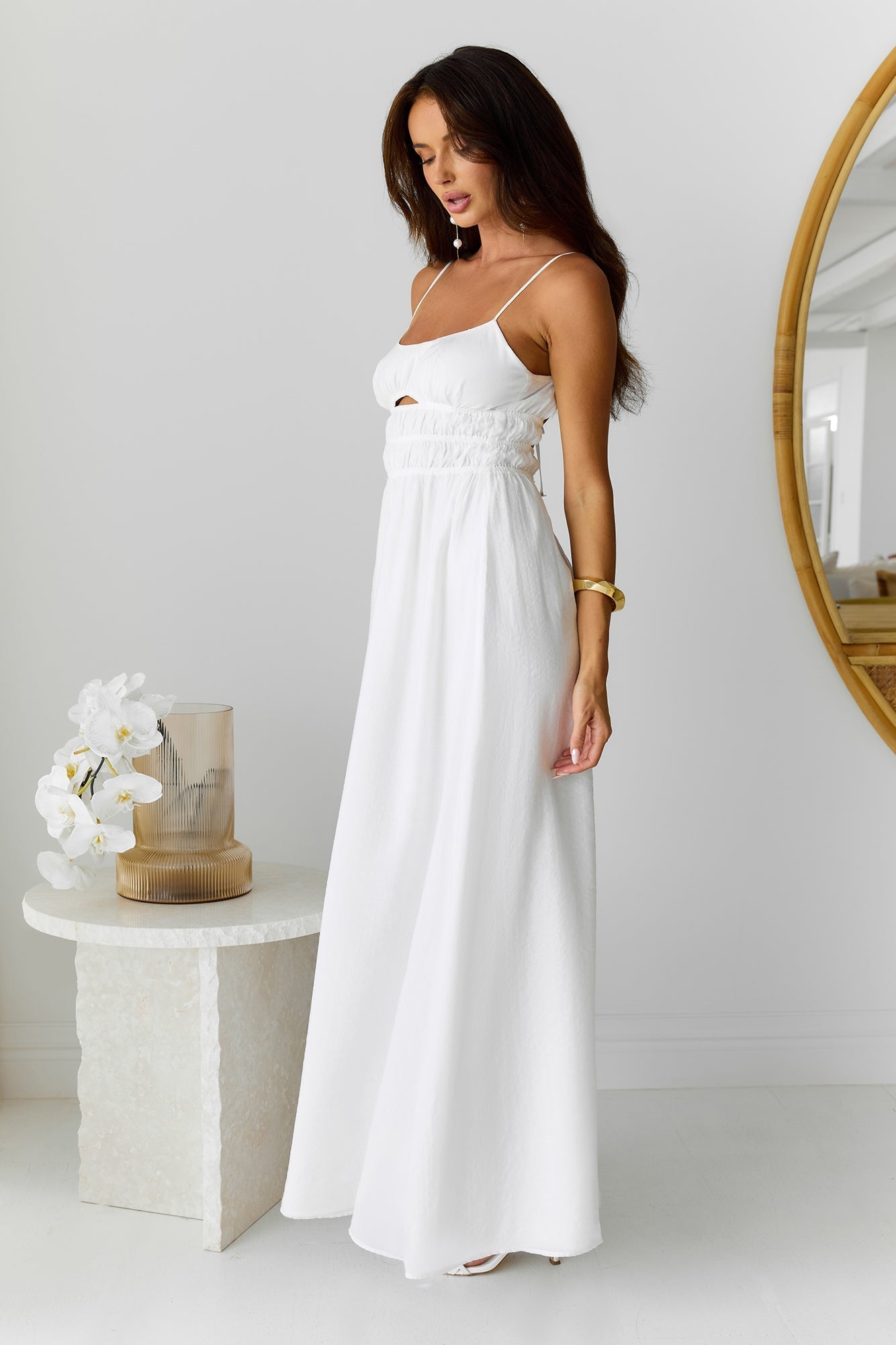 White long dress with narrow straps and hollow-out details