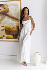 White long dress with narrow straps and hollow-out details