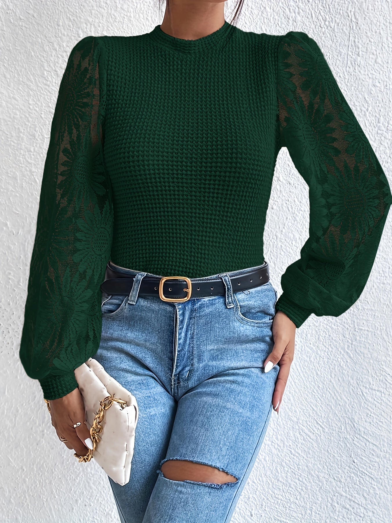 Stickad tröja med blommig ärm