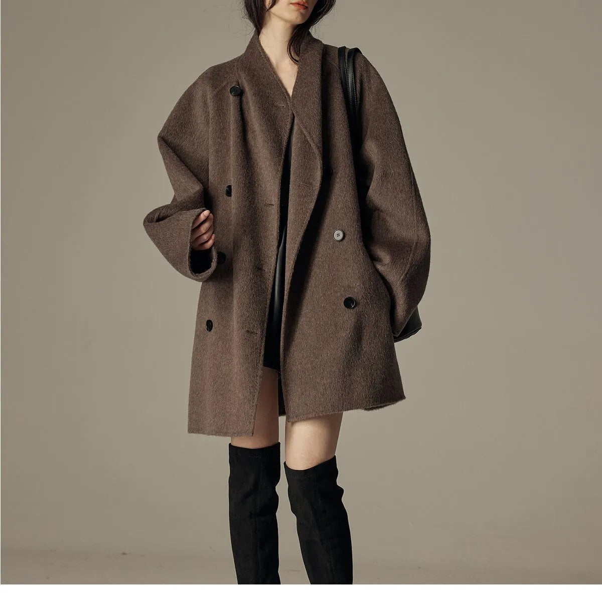 Oversized double-breasted coat with shawl collar.