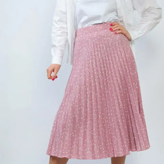 Pink pleated skirt with white polka dots