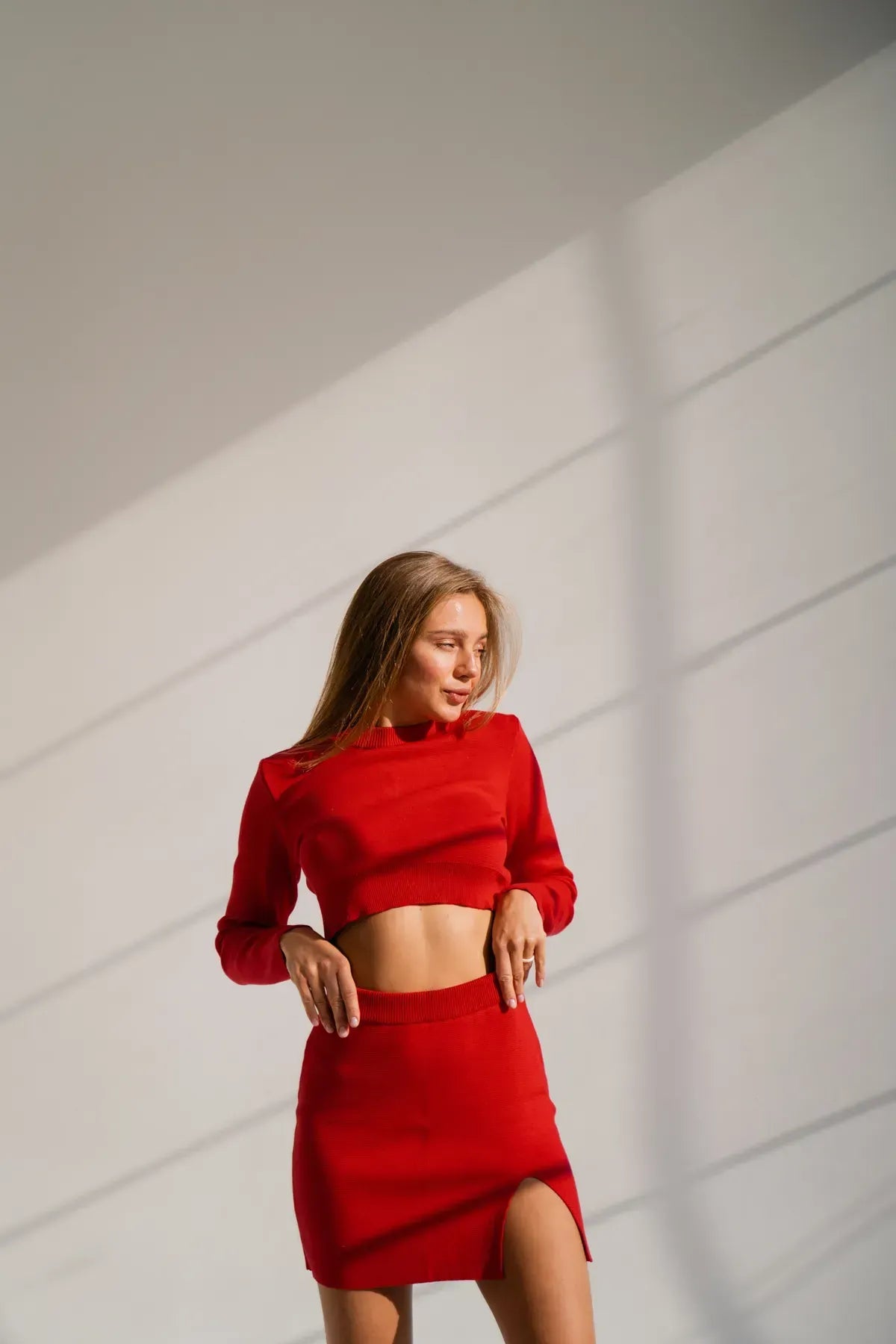 Red knit set with crop top and skirt