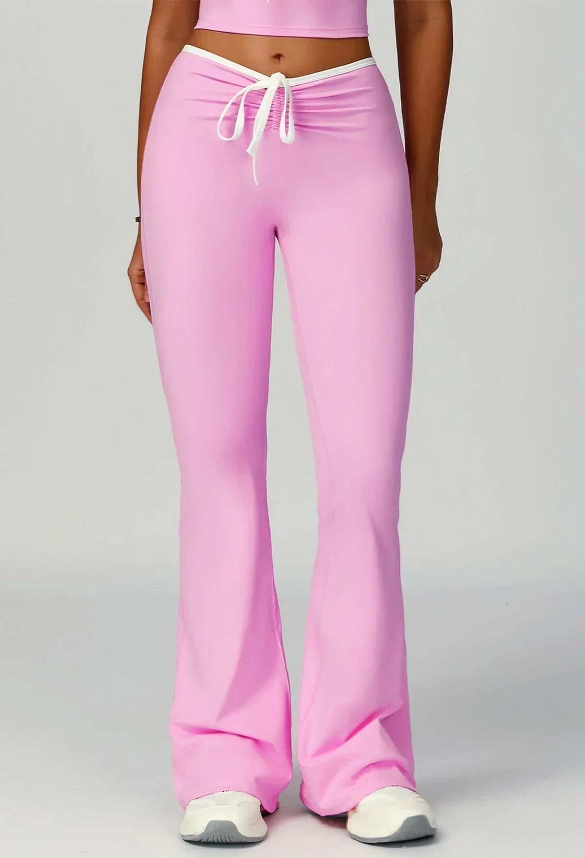 Sporty flared pants with bow detail