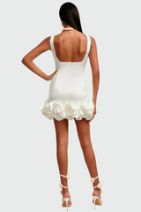 White mini dress with ruffled skirt