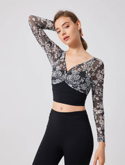 Floral patterned crop top with mesh sleeves