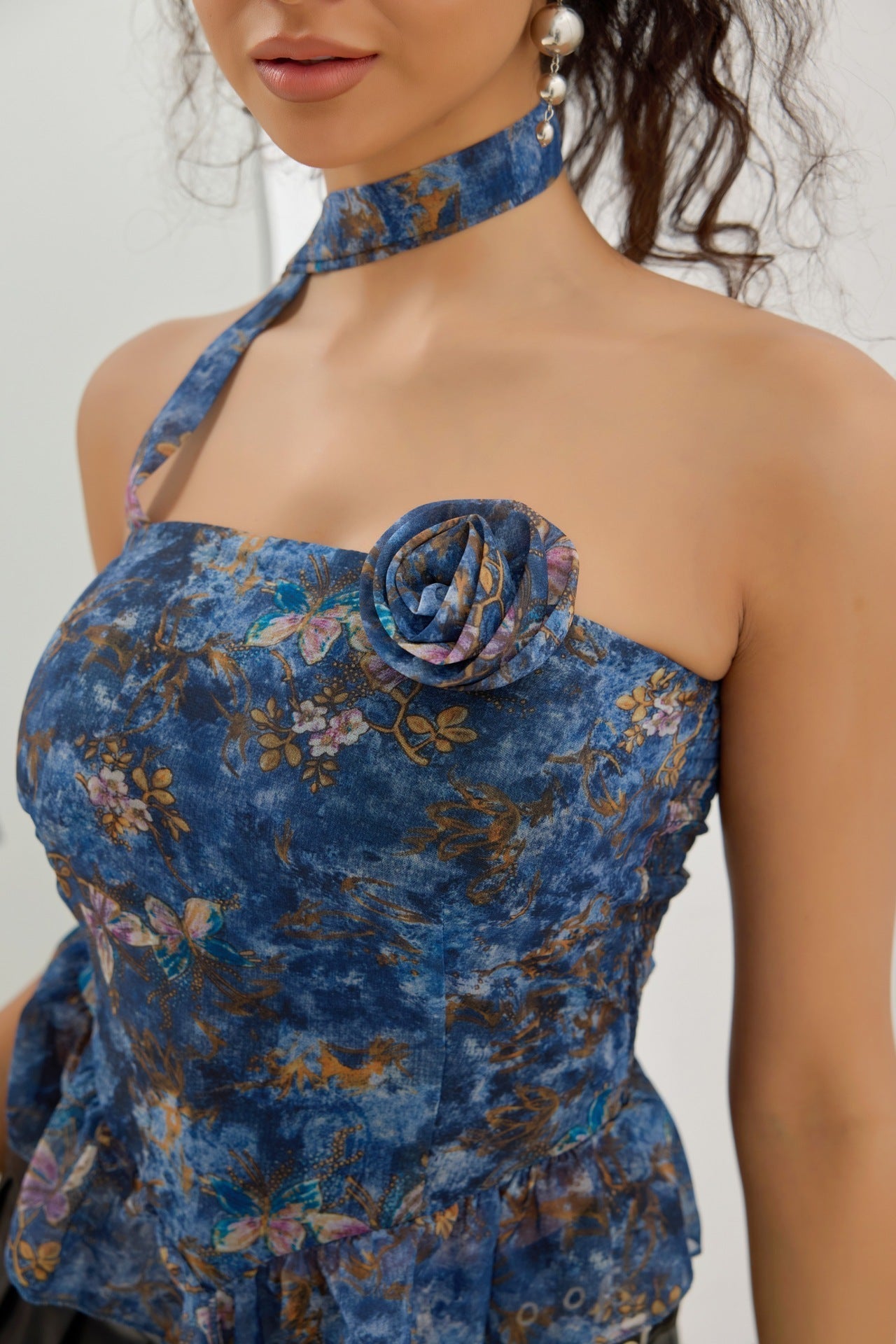 Blommig topp volangväst