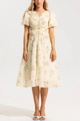 Cream-colored floral midi dress with ruched top
