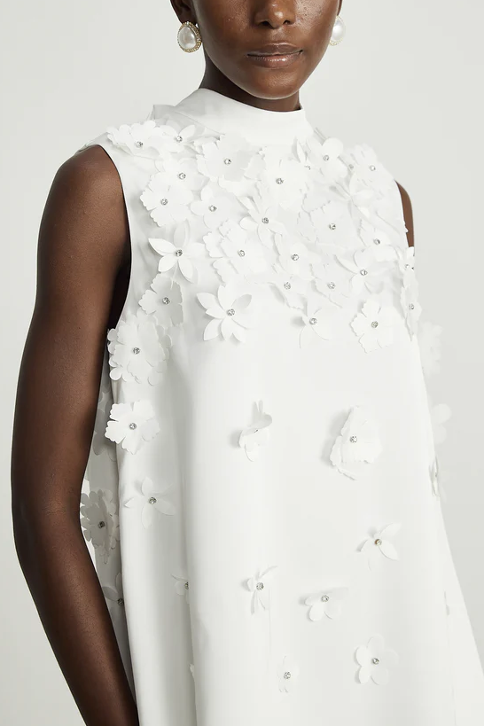White sleeveless dress with 3D flowers