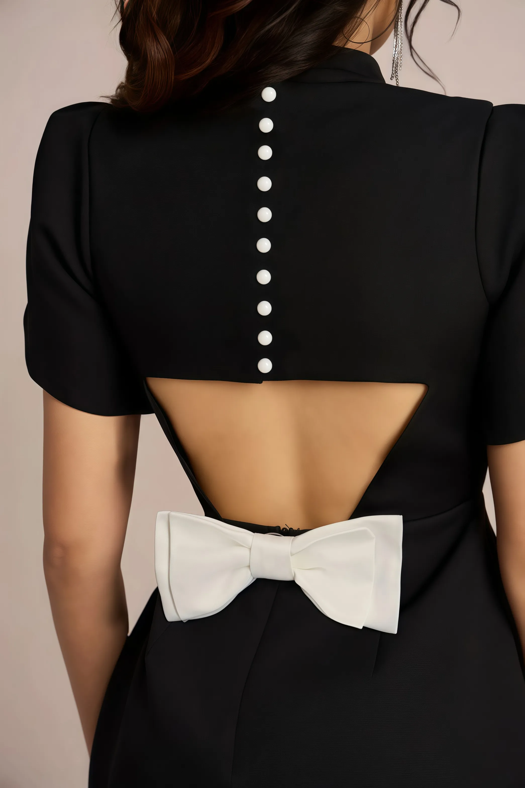 Black mini dress with accentuated shoulders