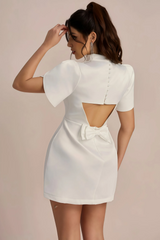 White mini dress with accentuated shoulders