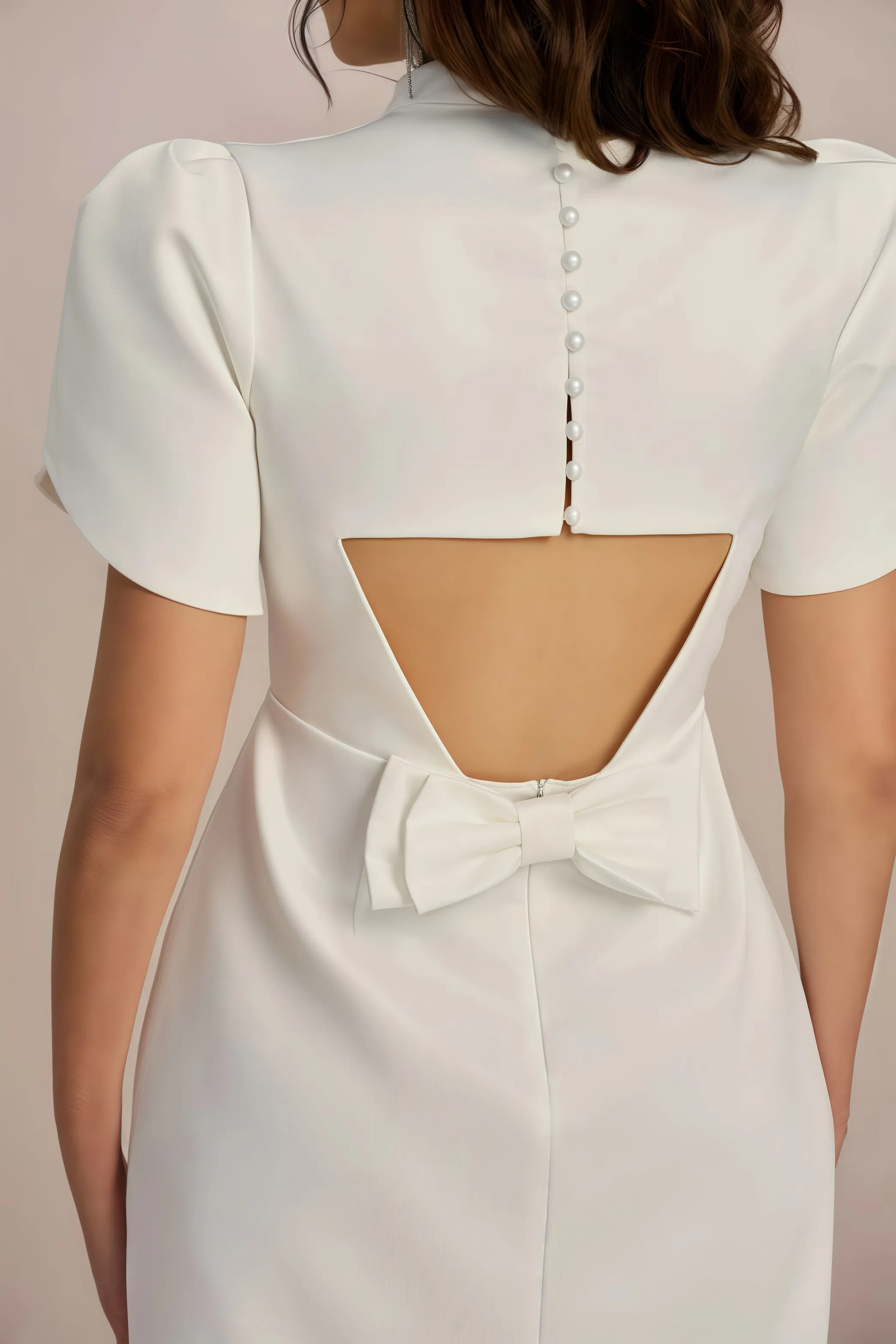 White mini dress with accentuated shoulders