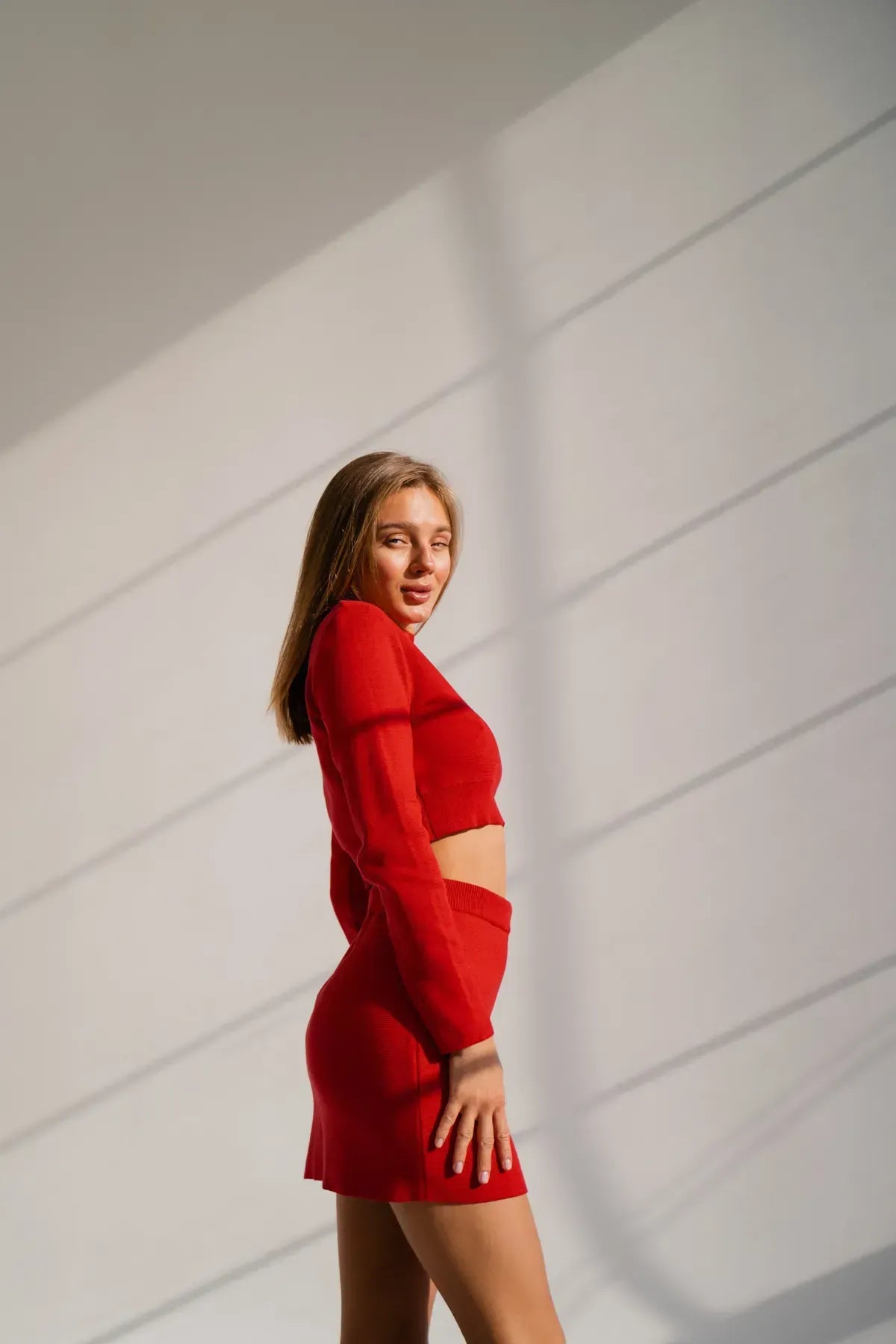 Red knit set with crop top and skirt