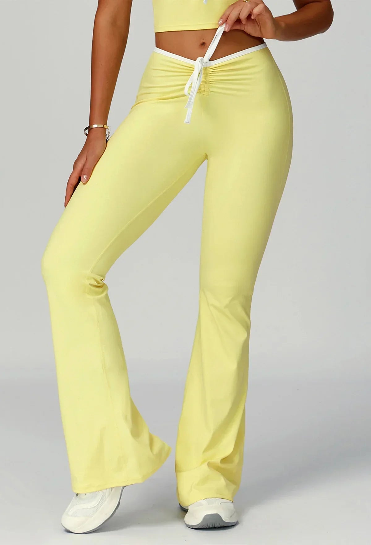 Sporty flared pants with bow detail
