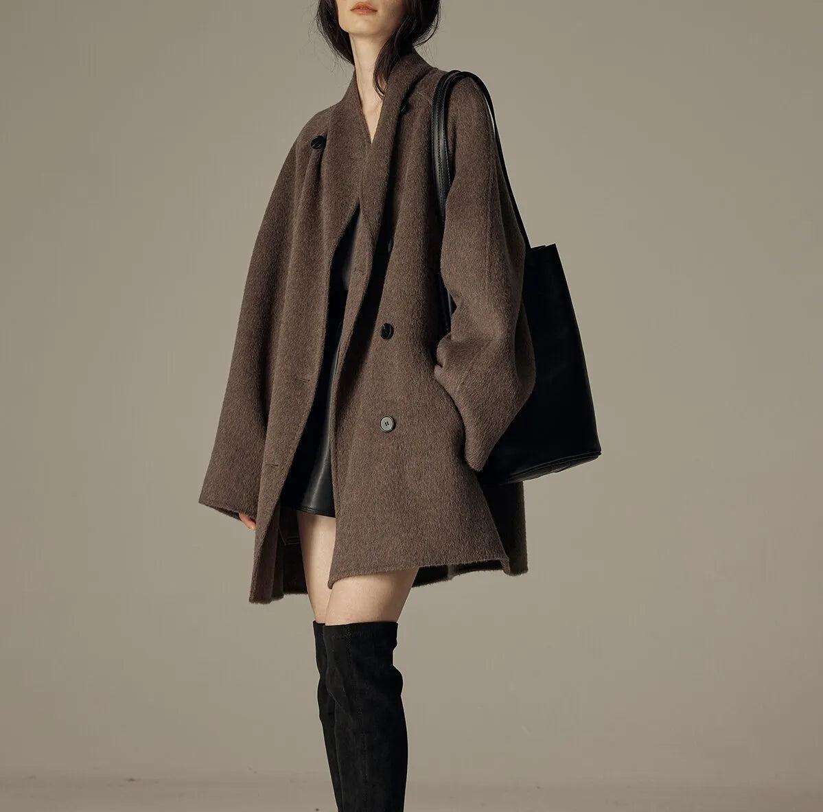 Oversized double-breasted coat with shawl collar.