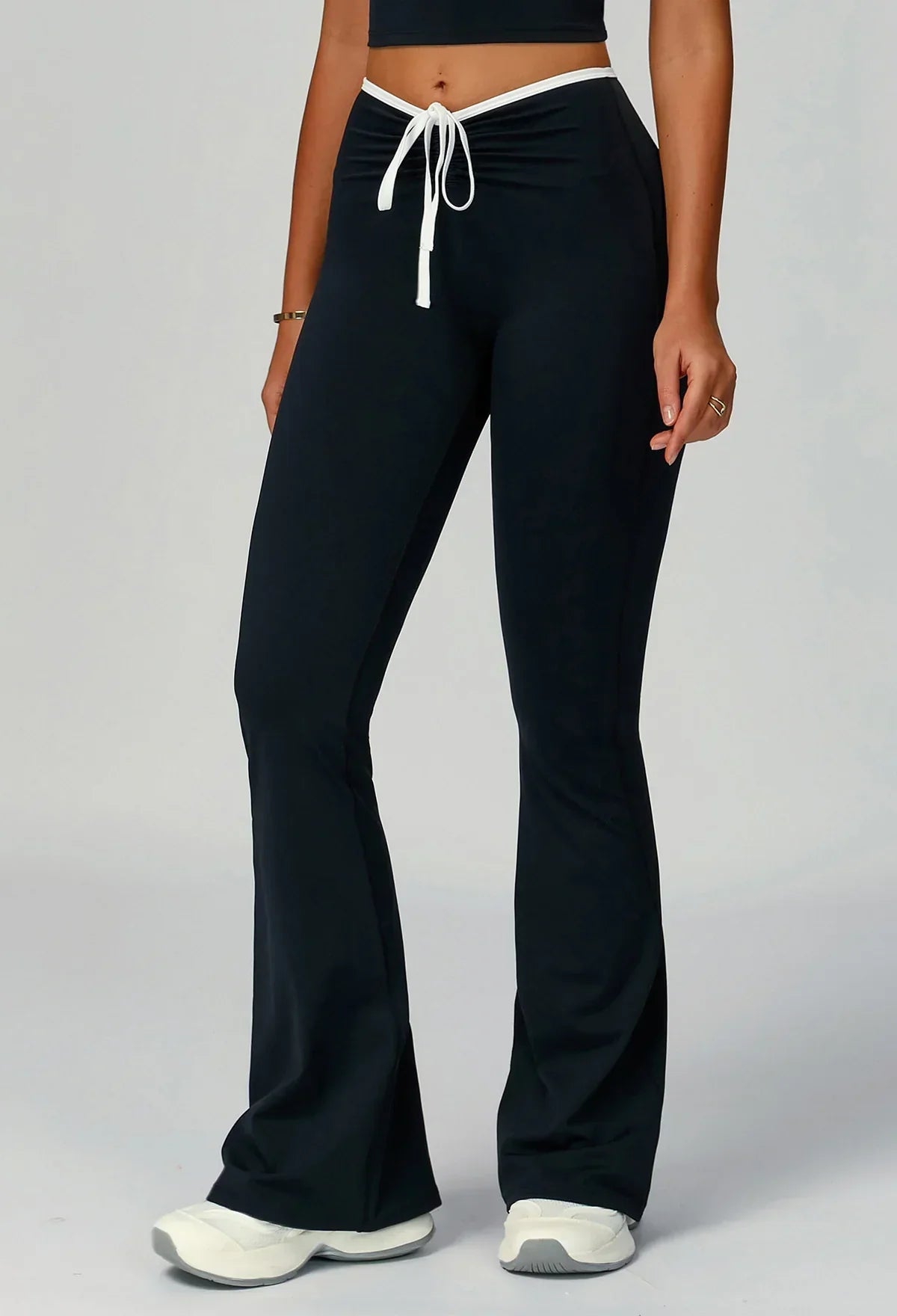 Sporty flared pants with bow detail