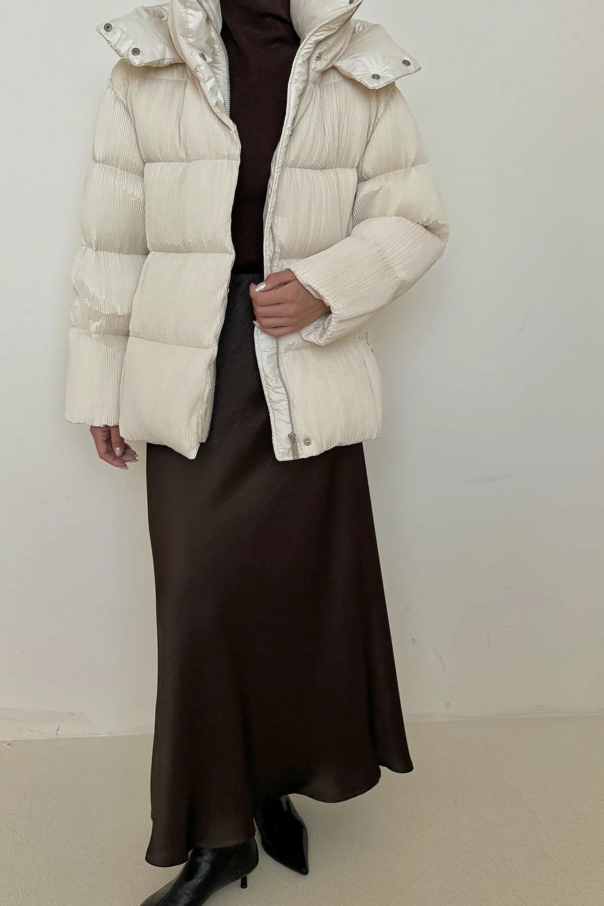 Puffer jacket with waist belt and high stand-up collar