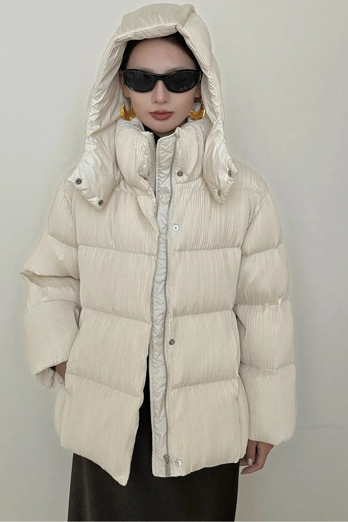 Puffer jacket with waist belt and high stand-up collar