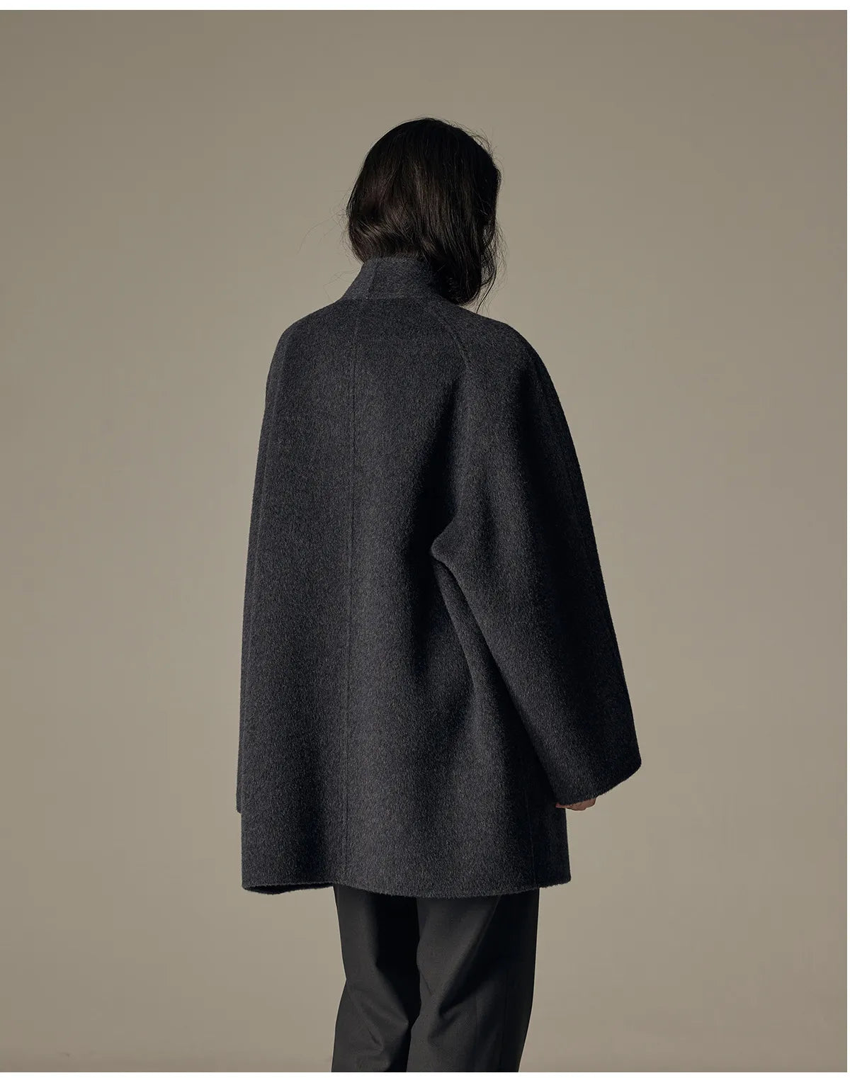 Oversized double-breasted coat with shawl collar.