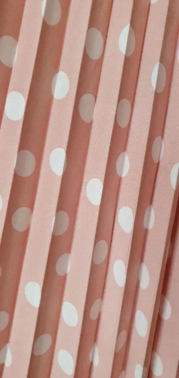 Pink pleated skirt with white polka dots