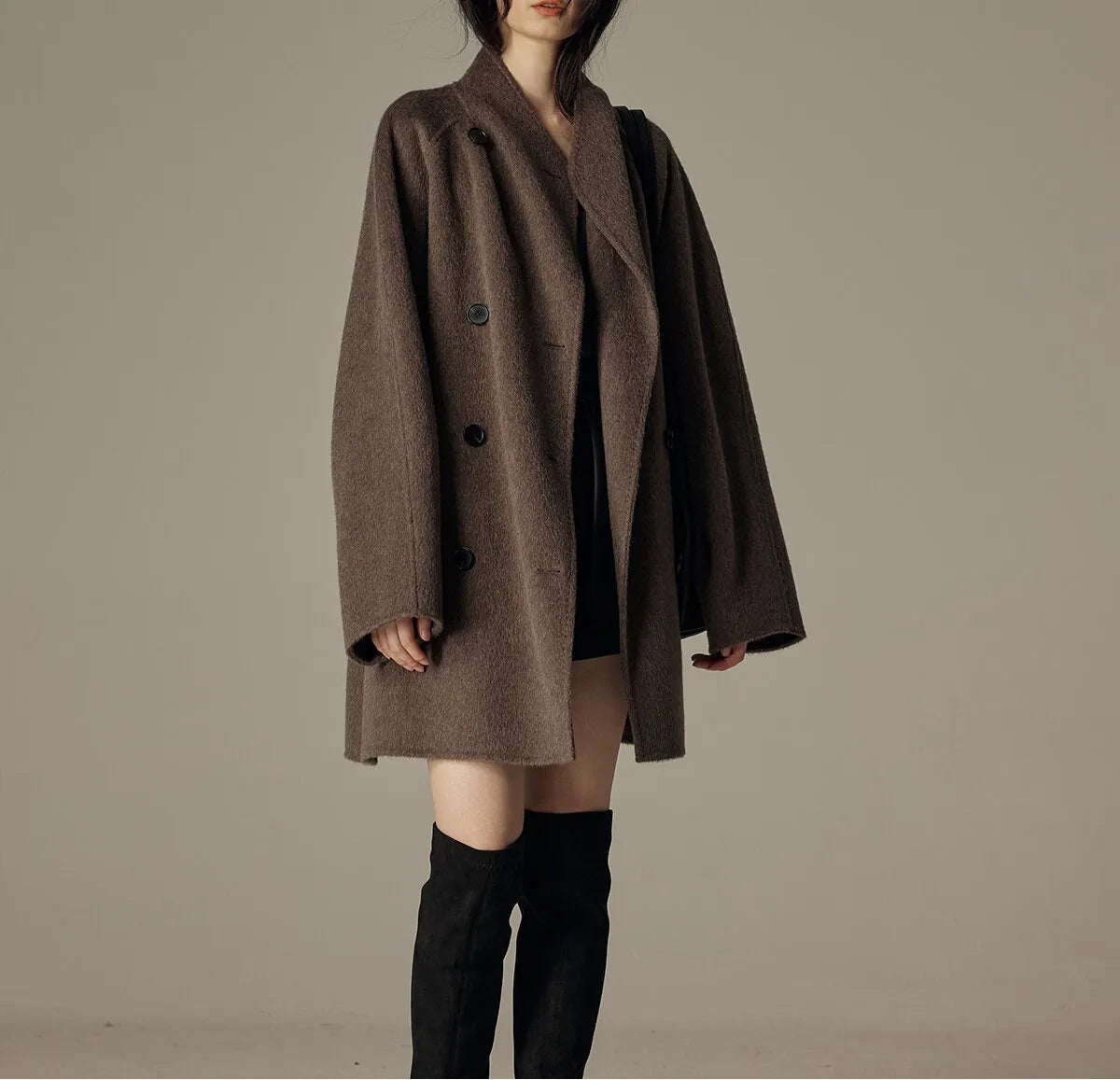 Oversized double-breasted coat with shawl collar.