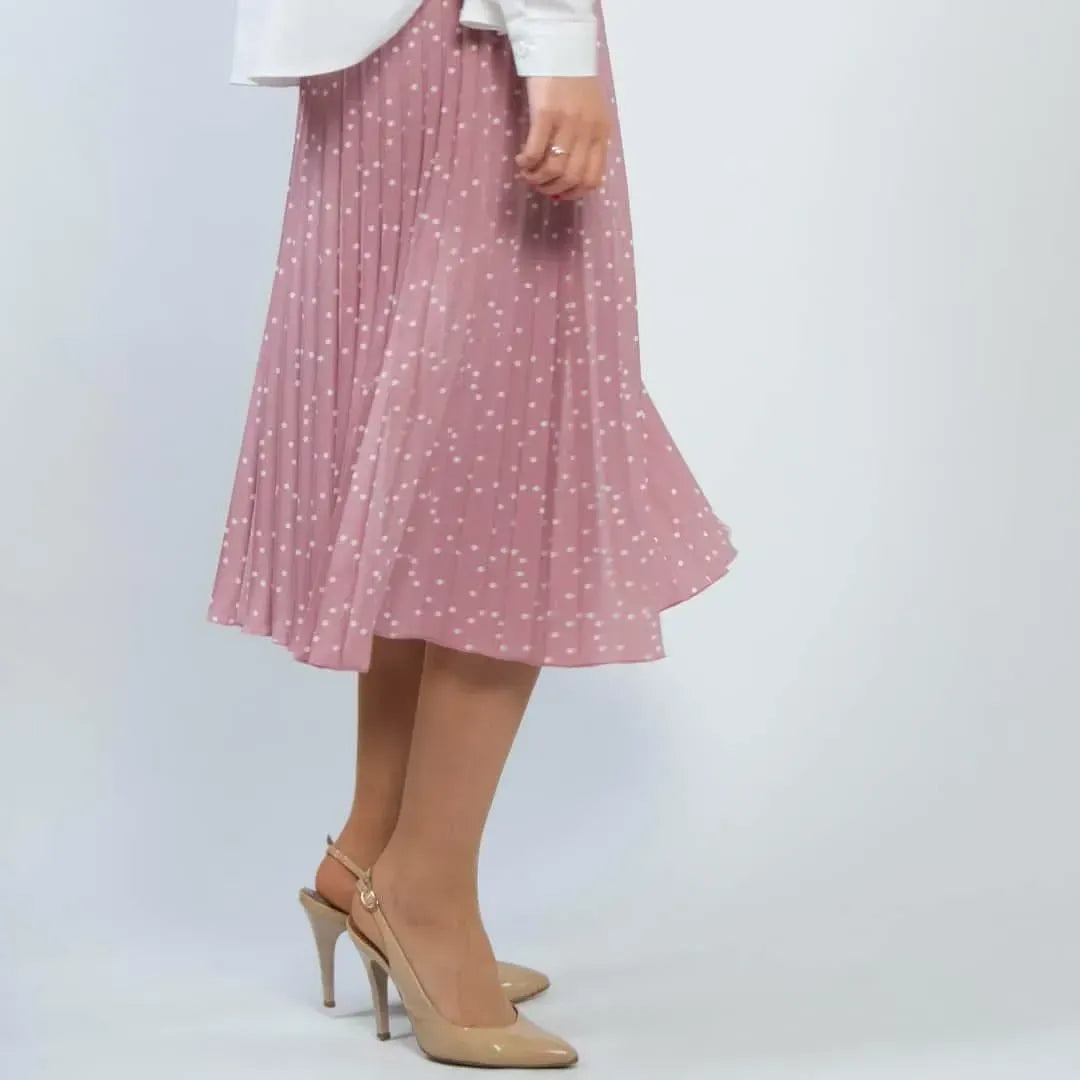 Pink pleated skirt with white polka dots