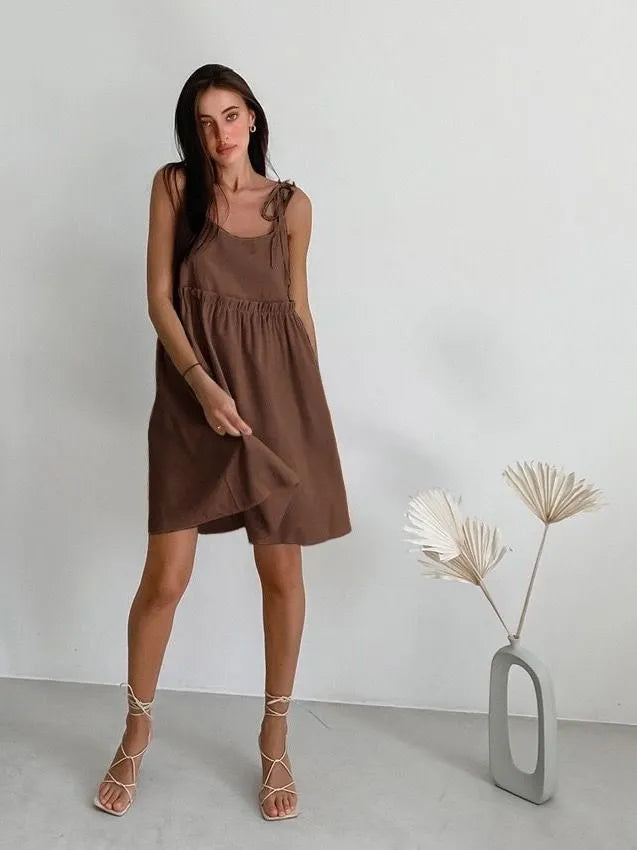 Sleeveless mini dress with bow ties