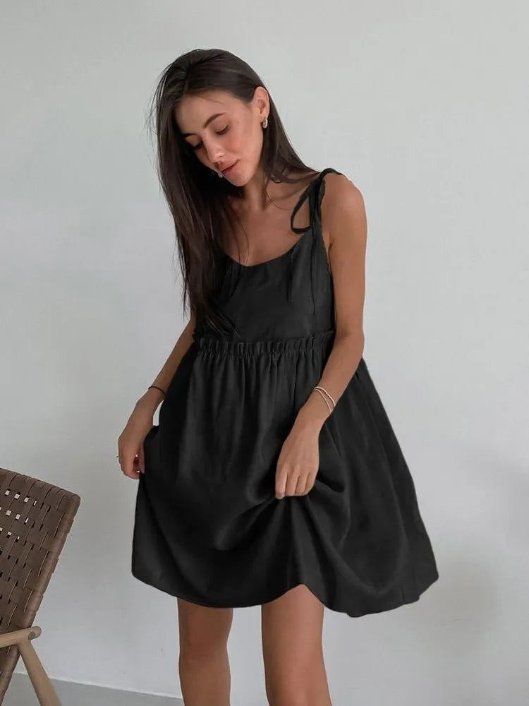 Sleeveless mini dress with bow ties