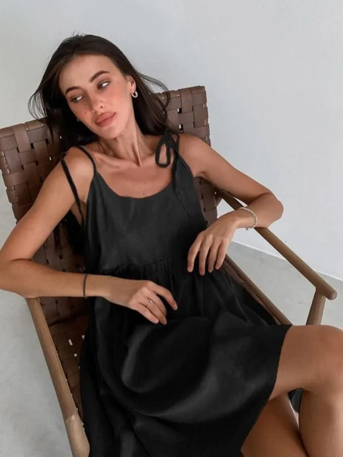 Sleeveless mini dress with bow ties