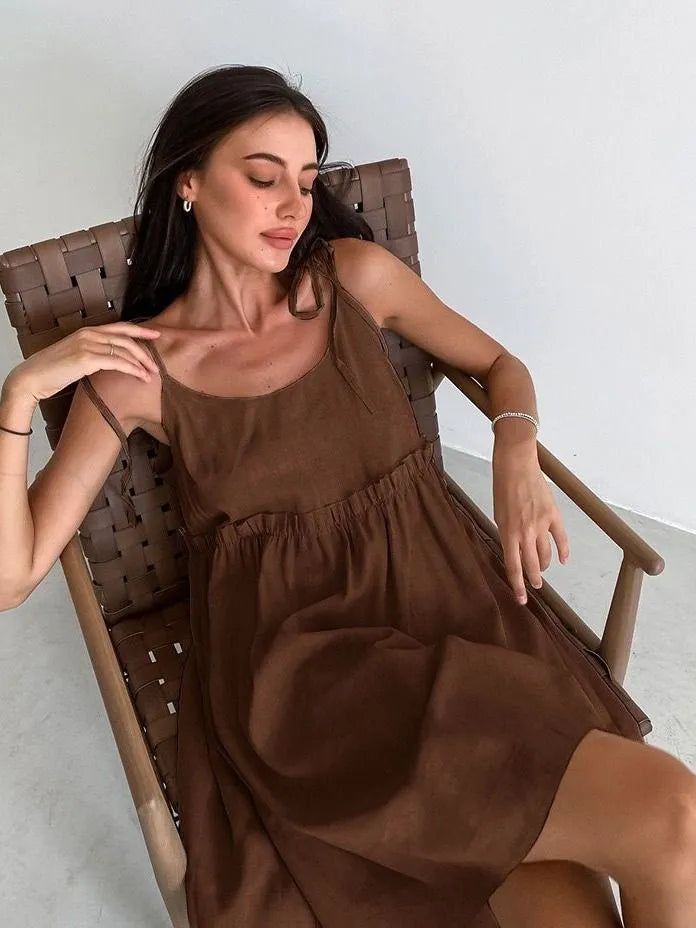 Sleeveless mini dress with bow ties