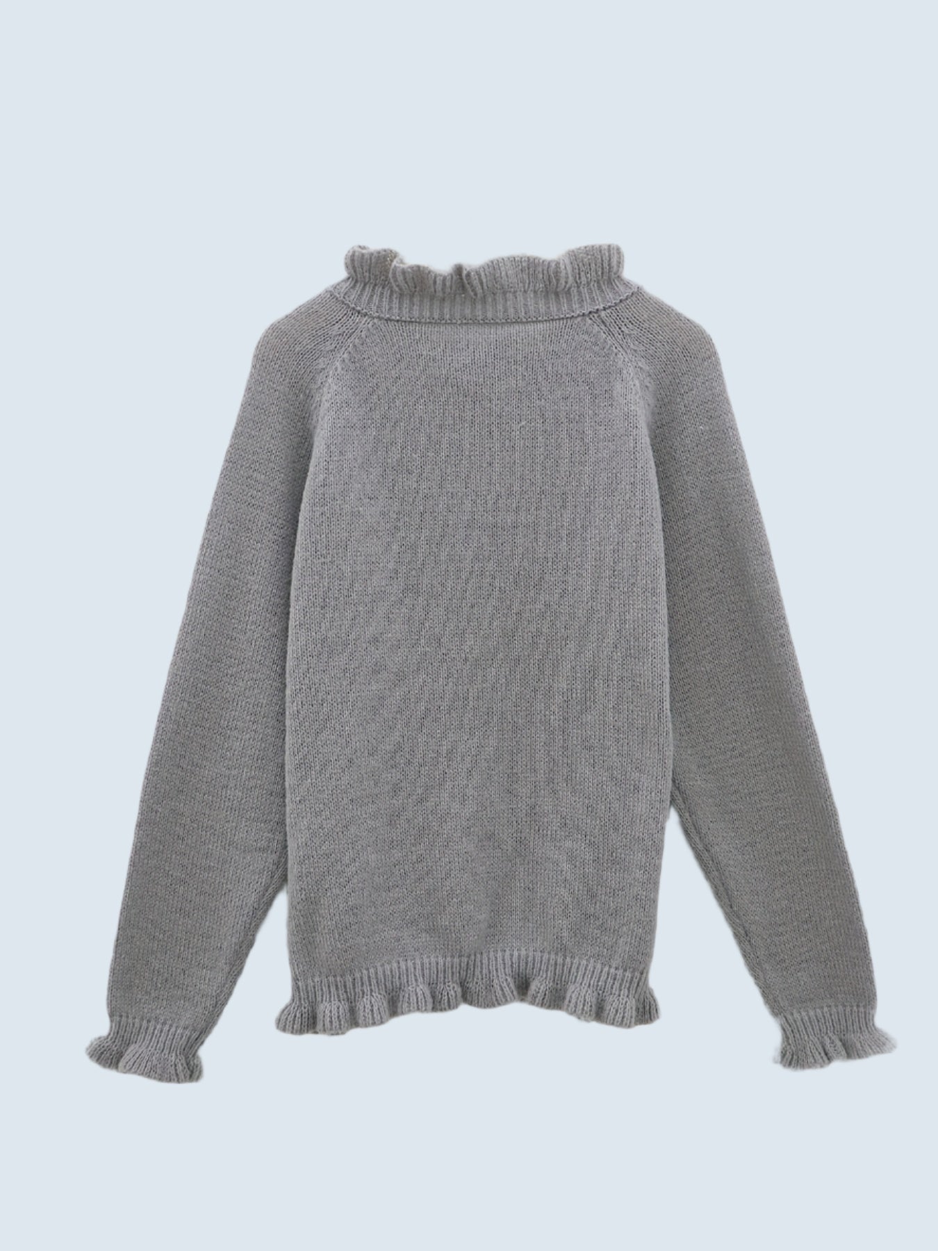 V-ringad tröja med volang i nederkanten