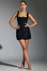 Black mini dress with three-dimensional pink details