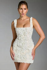 White mini dress with three-dimensional roses