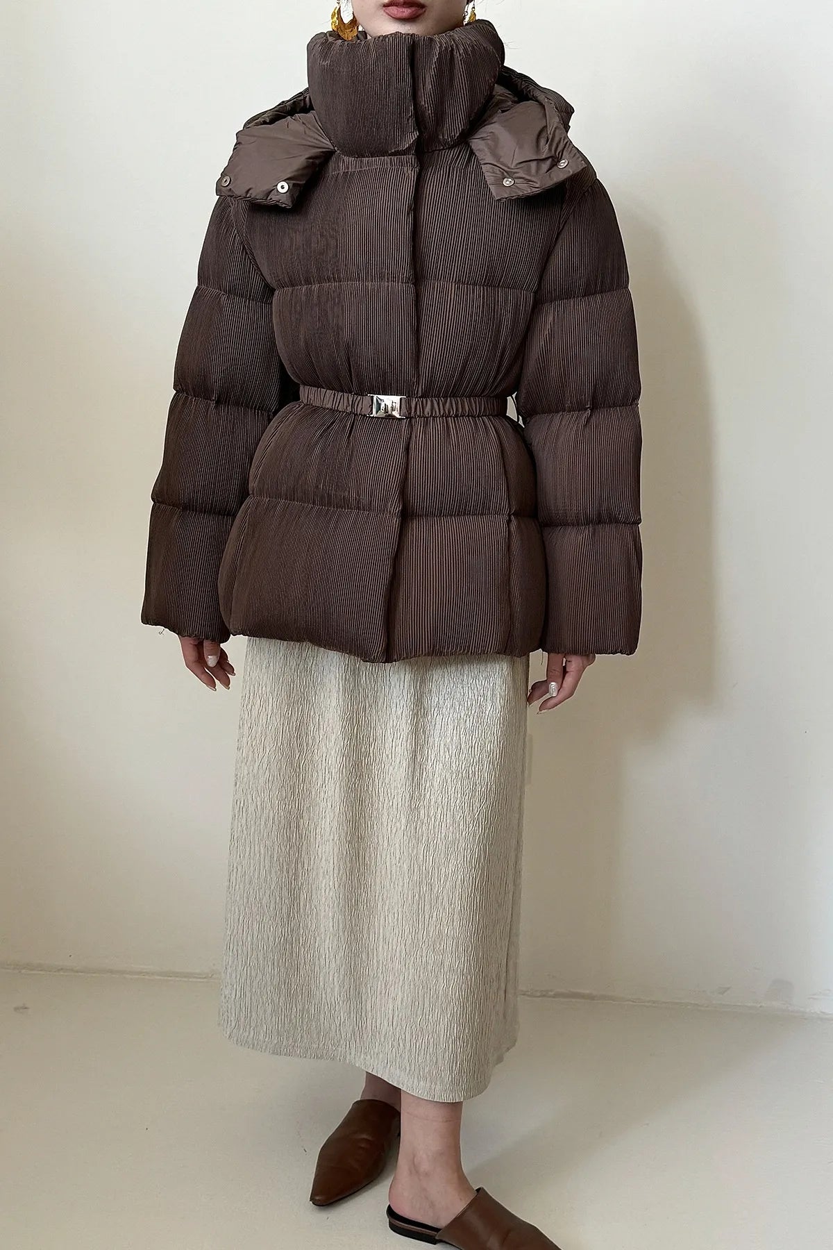 Puffer jacket with waist belt and high stand-up collar