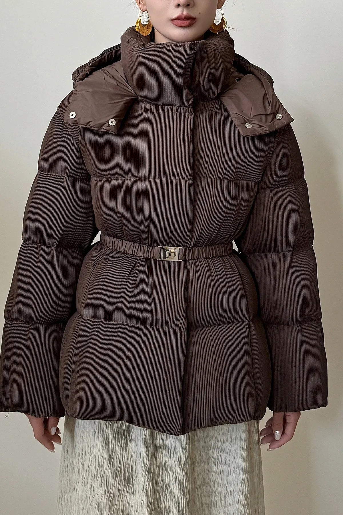 Puffer jacket with waist belt and high stand-up collar
