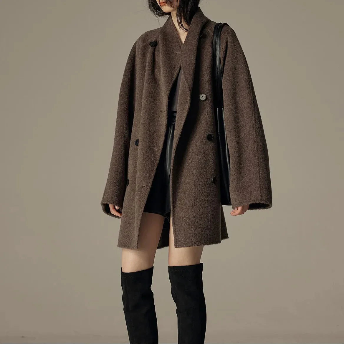 Oversized double-breasted coat with shawl collar.