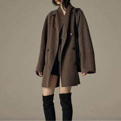 Oversized double-breasted coat with shawl collar.