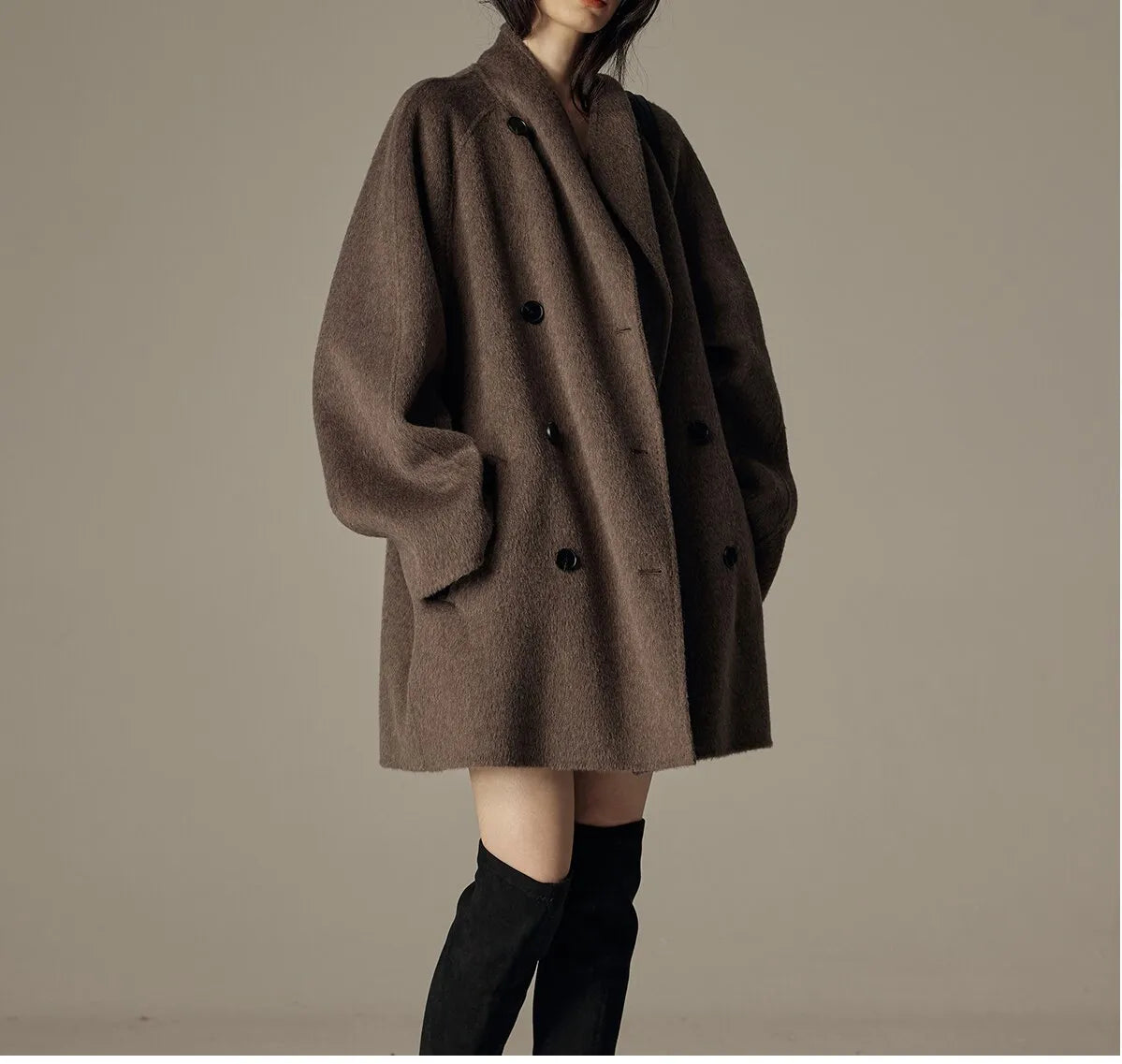 Oversized double-breasted coat with shawl collar.