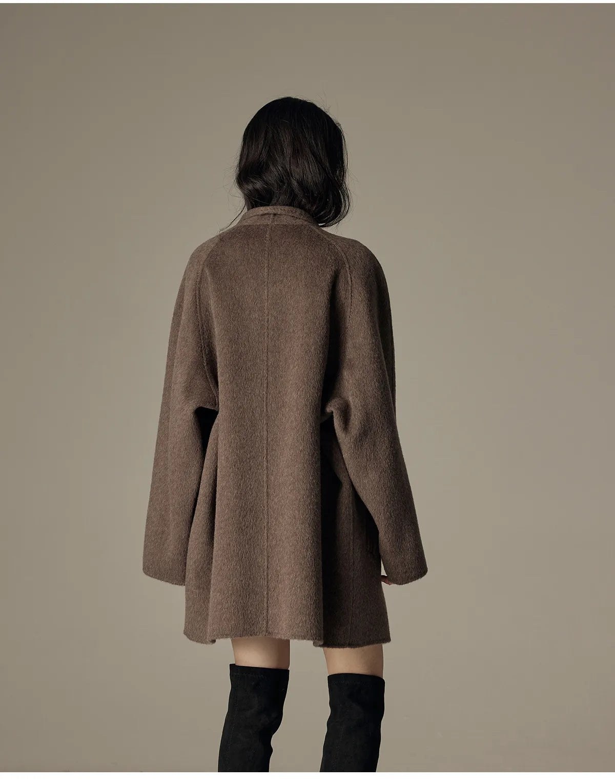 Oversized double-breasted coat with shawl collar.