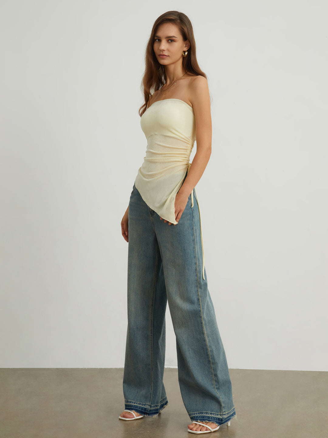 Strapless asymmetrical top with ruffle details