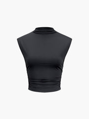 Black sleeveless crop top with high neck and pleated waist