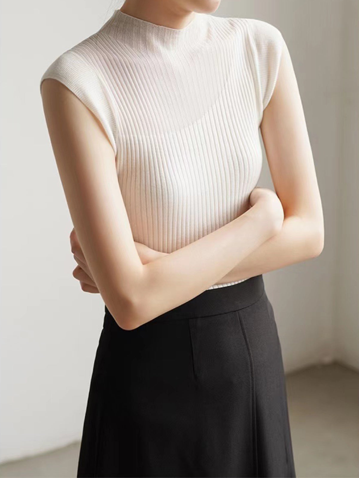 Sleeveless ribbed top with fishnet details