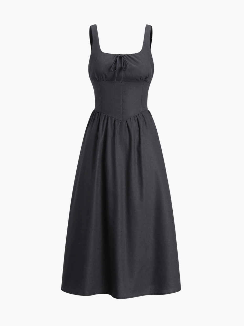 Black dress with fitted waist and bow detail