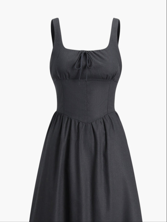 Black dress with fitted waist and bow detail