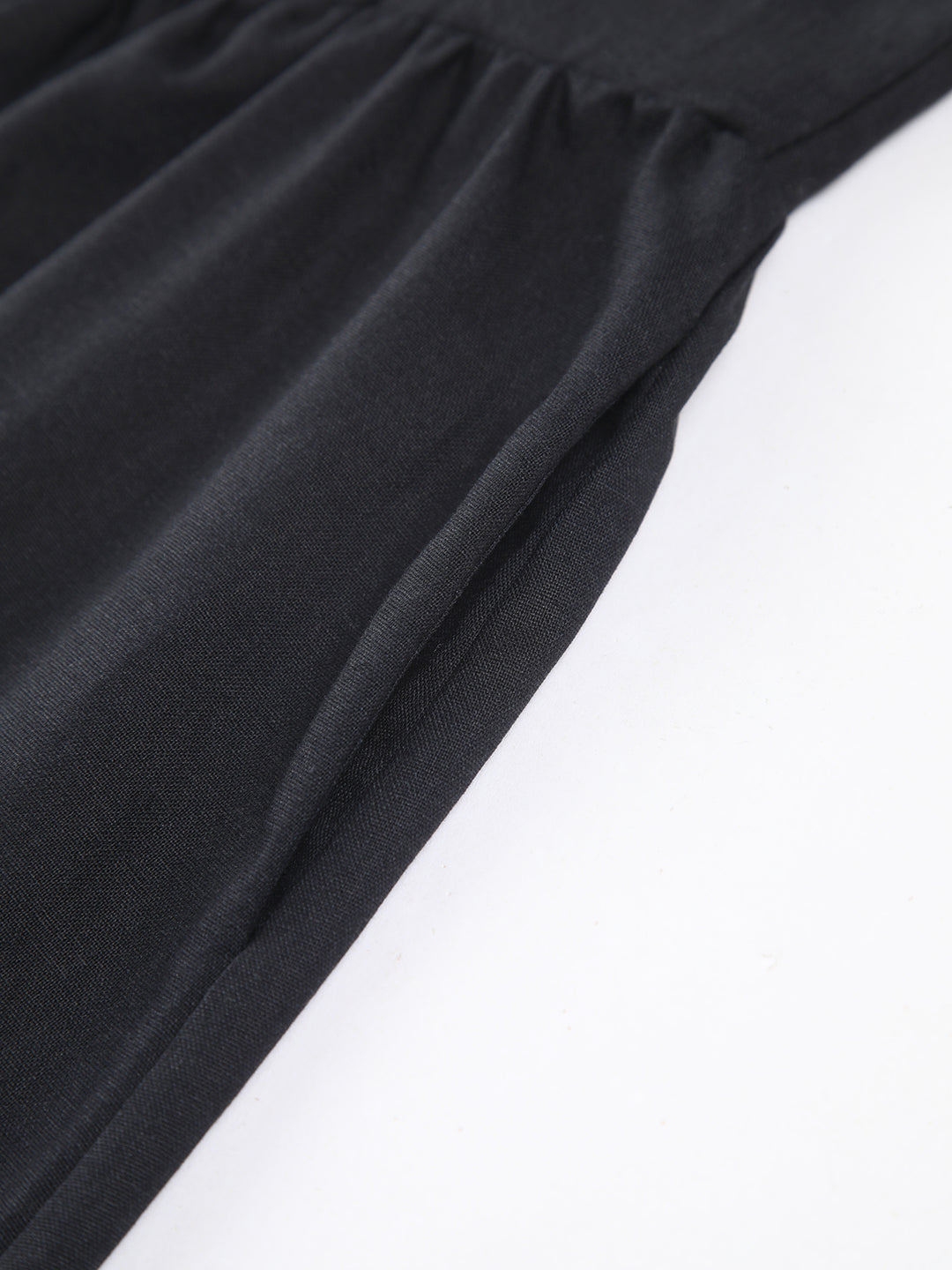 Black dress with fitted waist and bow detail