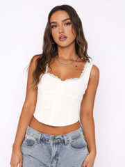 White corset top with button details and lace trim