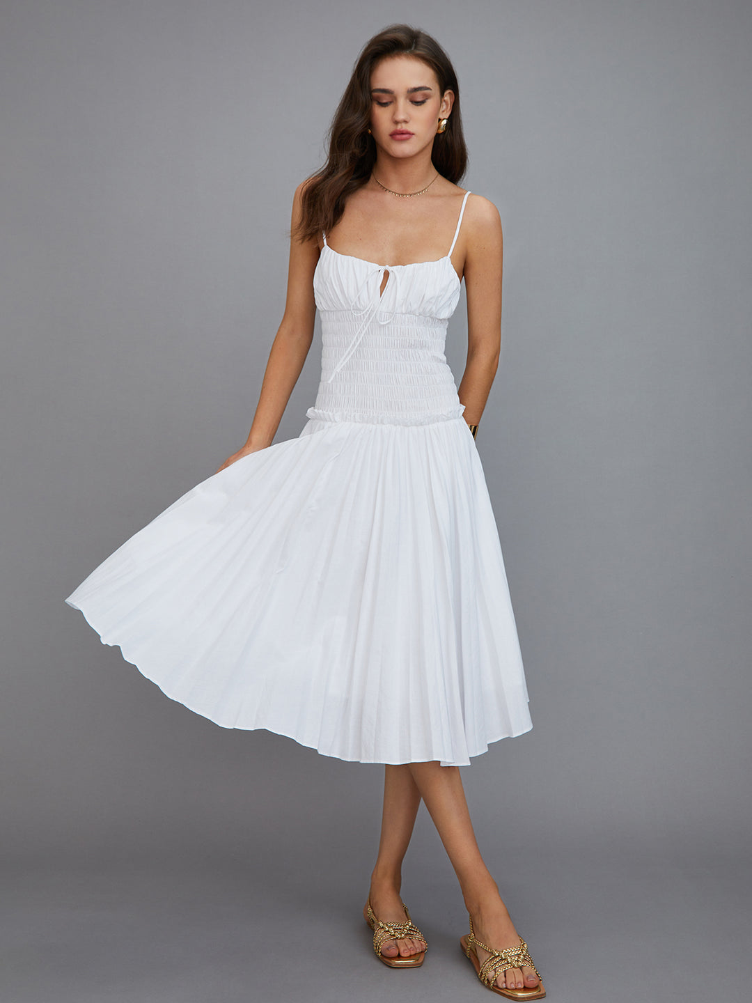 White pleated midi dress with thin straps