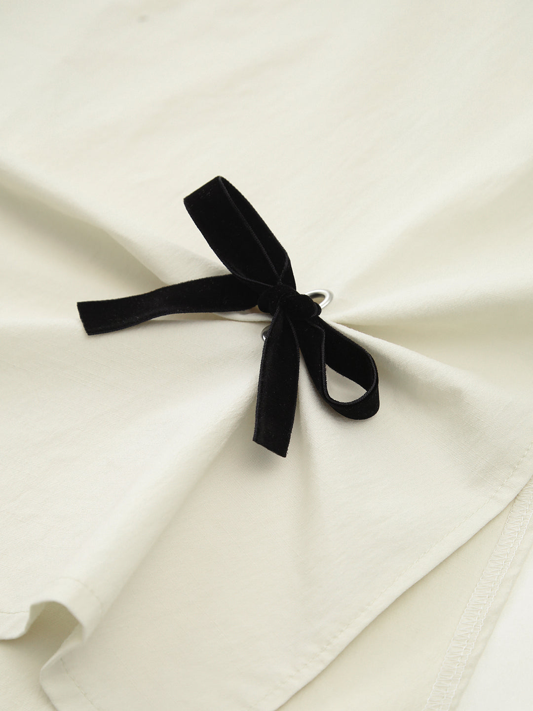 White midi skirt with black bow details