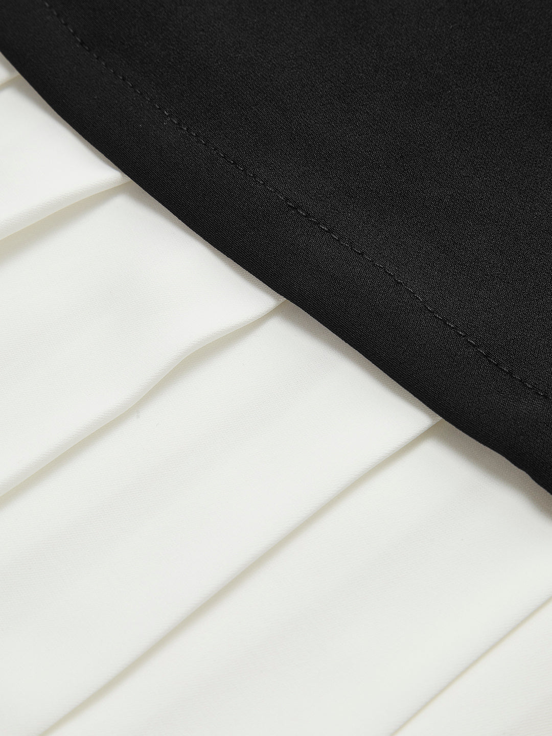 Pleated mini dress with contrasting skirt